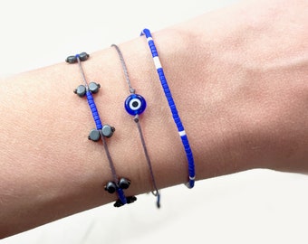 Dainty blue evil eye protection bracelet from Greece. Stacking minimalist thin bracelets. Real Miyuki & hematite beaded adjustable bracelets