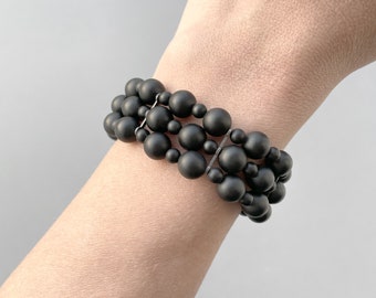 Matte black onyx multi strand beaded bracelet with oxidized sterling silver details.