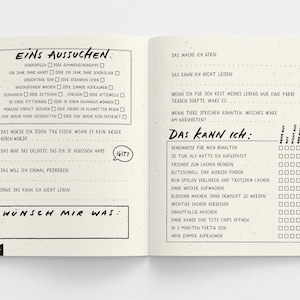 May include: Open notebook with handwritten German text. The left page has a list of options, the right page has fill-in-the-blank prompts. The notebook is open on a white surface.