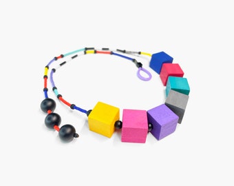 Wooden geometric statement necklace with colorful hand painted wooden beads, black onyx and miyuki seeds | Wearable art summer necklace