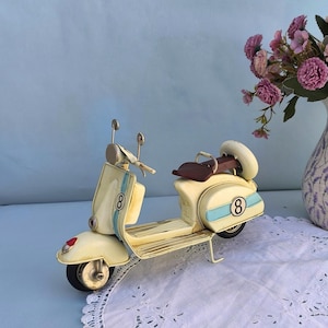 Off White Vespa Scooter with Number 8, Retro Collectible Motorcycle