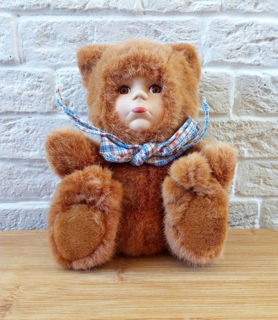 porcelain doll with teddy bear