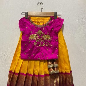 Flaming Yellow Kanchi Pattu Pavadai With Twin Elephant  Embroidered Top