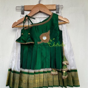 White Kanchipuram Silk Skirt With One Shoulder Peplum Top