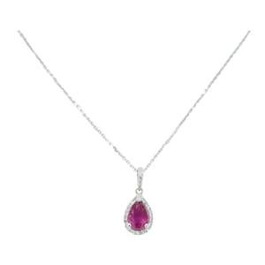 May include: A silver necklace with a pear-shaped pendant. The pendant has a vibrant red gemstone surrounded by a halo of small, clear gemstones. The chain is delicate and the pendant hangs gracefully.