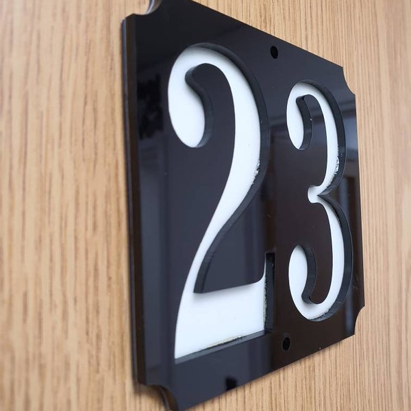 Glow in the dark house number sign