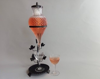 Italian Glass Wine Fountain on a decorative wrought iron support, 1970s