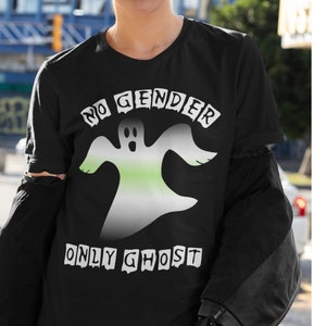 May include: Black t-shirt featuring a white ghost graphic and the text "NO GENDER ONLY GHOST". The ghost is outlined in green and white.