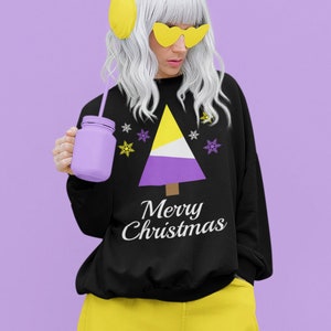 May include: Black sweatshirt with a purple, yellow and white Christmas tree design and the text "Merry Christmas".