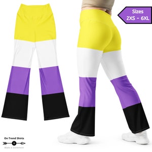 May include: A pair of black, white, yellow, and purple flared leggings. The leggings feature the colors of the non-binary pride flag. The leggings are available in sizes 2XS - 6XL.