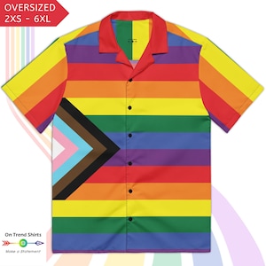 May include: A short-sleeved button-down shirt with a rainbow stripe design and a progressive pride flag graphic. The shirt has a red collar and is labeled "Oversized 2XS - 6XL". The shirt is a vibrant and colorful garment.