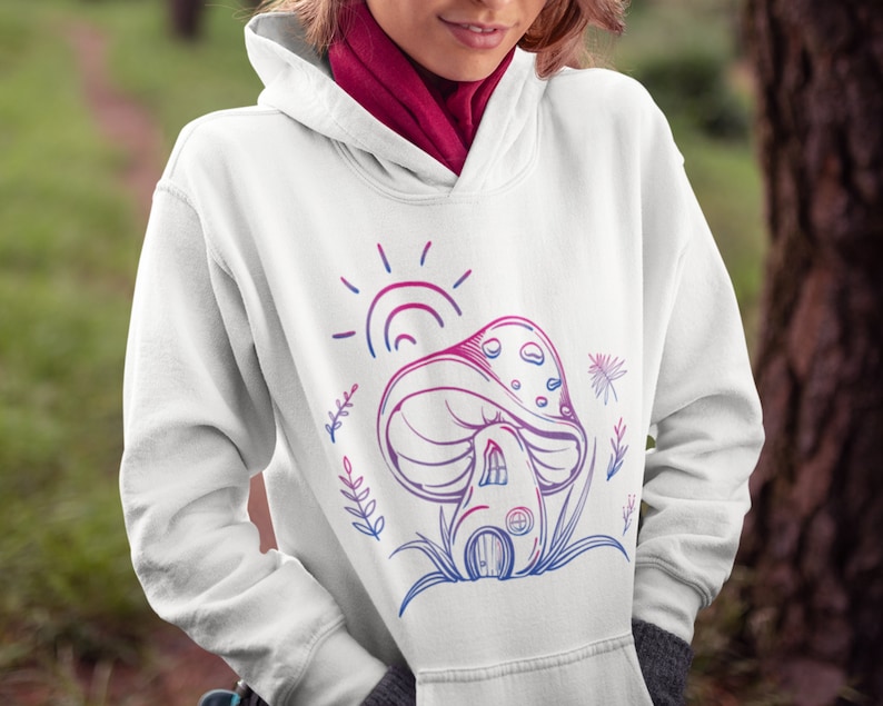 May include: White hoodie with a pink and blue graphic of a mushroom house with a sun and flowers.