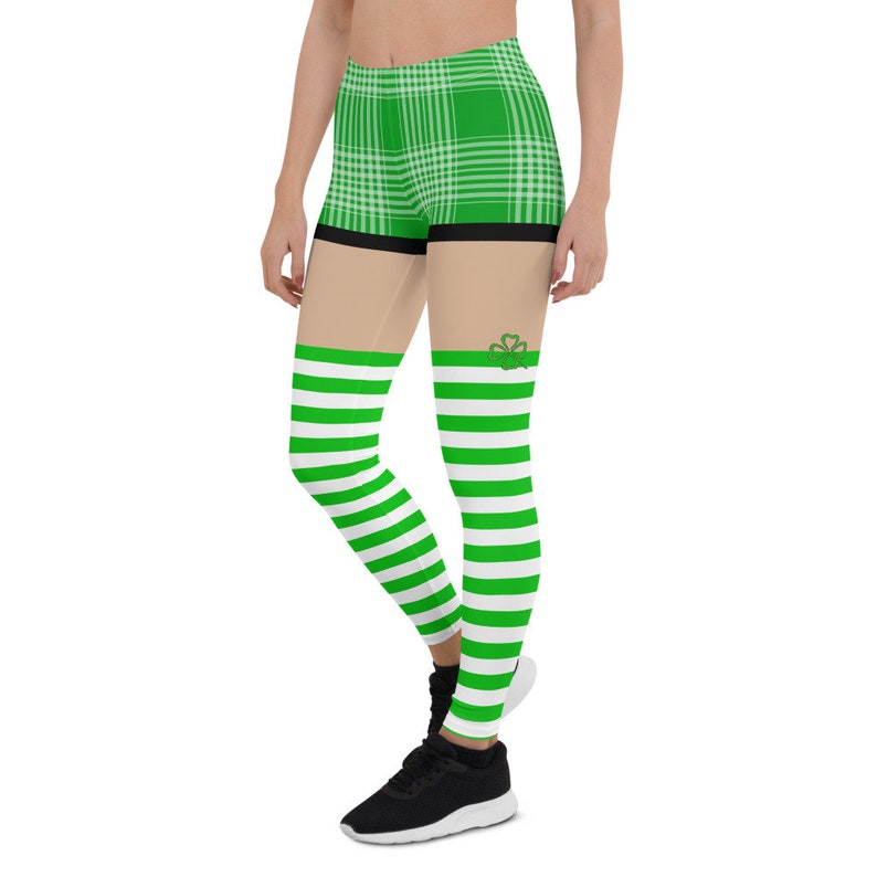 May include: Green and white striped leggings with a green plaid pattern on the top half. The leggings have a shamrock design on the side.