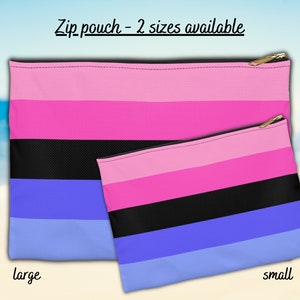 May include: Two zippered pouches with a pink, black, blue, and light blue striped pattern. The larger pouch is labelled "large" and the smaller pouch is labelled "small".