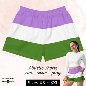 May include: Athletic shorts with a purple, white, and green striped pattern. The shorts are made for running, swimming, and playing. Sizes XS - 3XL.