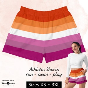May include: Athletic shorts with a rainbow stripe pattern in orange, pink, and white. The shorts are made for running, swimming, and playing. Sizes XS to 3XL.