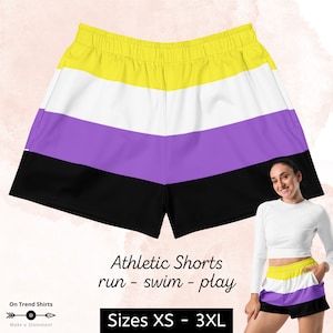 May include: Athletic shorts with a yellow, white, purple, and black striped pattern. The shorts are designed to be worn for running, swimming, or playing sports. Sizes XS - 3XL.