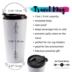 May include: White travel mug with a black lid and a black and white arrow design. The mug is 7.09 inches tall and has a 15 ounce capacity.