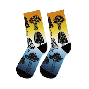 May include: A pair of black and white socks with a gradient design. The socks feature a pattern of mushrooms in various shapes and sizes. The socks are a blue and yellow gradient.