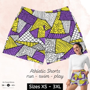 May include: Purple and yellow athletic shorts with a geometric pattern. The shorts are made of a stretchy, moisture-wicking fabric and are perfect for running, swimming, or playing sports. Sizes XS - 3XL.