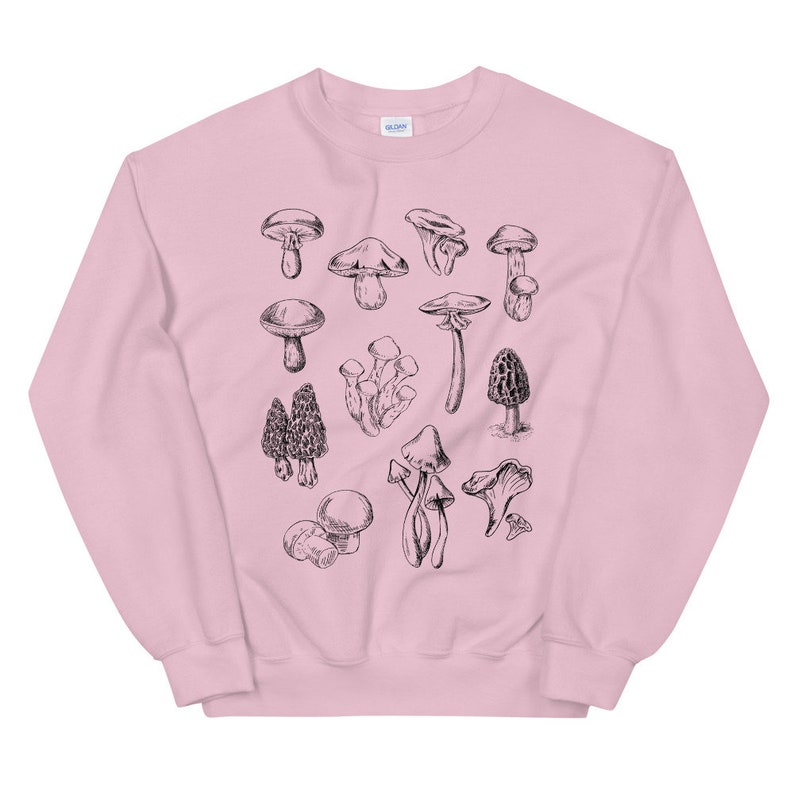 May include: A pink sweatshirt with a black and white illustration of various types of mushrooms.