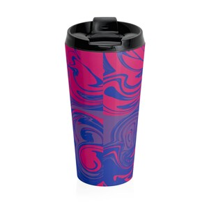 May include: A stainless steel travel mug with a black lid. The mug has a pink and blue swirl pattern.