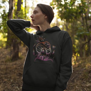 May include: Black hooded sweatshirt with a colorful graphic of a mushroom with a sun and flowers.