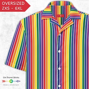 May include: Rainbow striped button-up shirt with short sleeves. The shirt features vertical stripes in red, orange, yellow, green, blue, and purple. The text "OVERSIZED 2XS - 6XL" is in a red box. The text "On Trend Shirts" and "Make a Statement" are also visible.