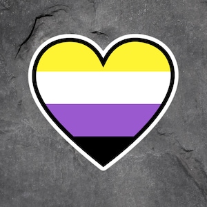 May include: A heart-shaped sticker with the colors of the non-binary pride flag. The flag is yellow, white, purple, and black.
