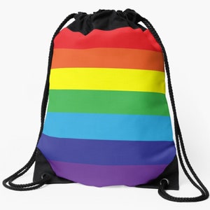 May include: A rainbow drawstring bag with a black drawstring and a black lining. The bag features a rainbow design with red, orange, yellow, green, blue, indigo, and violet stripes.