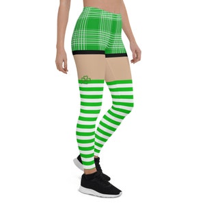 May include: Green and white striped leggings with a green plaid pattern at the top. The leggings have a shamrock design on the thigh.