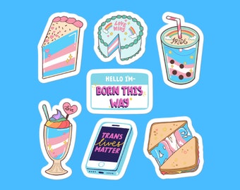 Puede incluir: Una colección de pegatinas coloridas sobre un fondo azul. Las pegatinas presentan varias ilustraciones con temática de Orgullo, incluyendo una rebanada de pastel, un pastel entero, una bebida con pajita, un helado, un smartphone con el texto "Trans Lives Matter", una etiqueta con "Born This Way", y un sándwich.