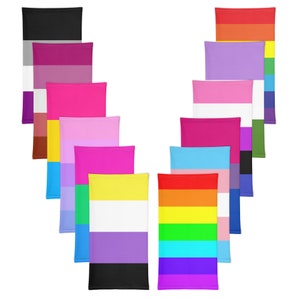 May include: A set of 10 different pride flag designs printed on fabric. The flags are arranged in a V-shape, with the rainbow flag at the bottom.