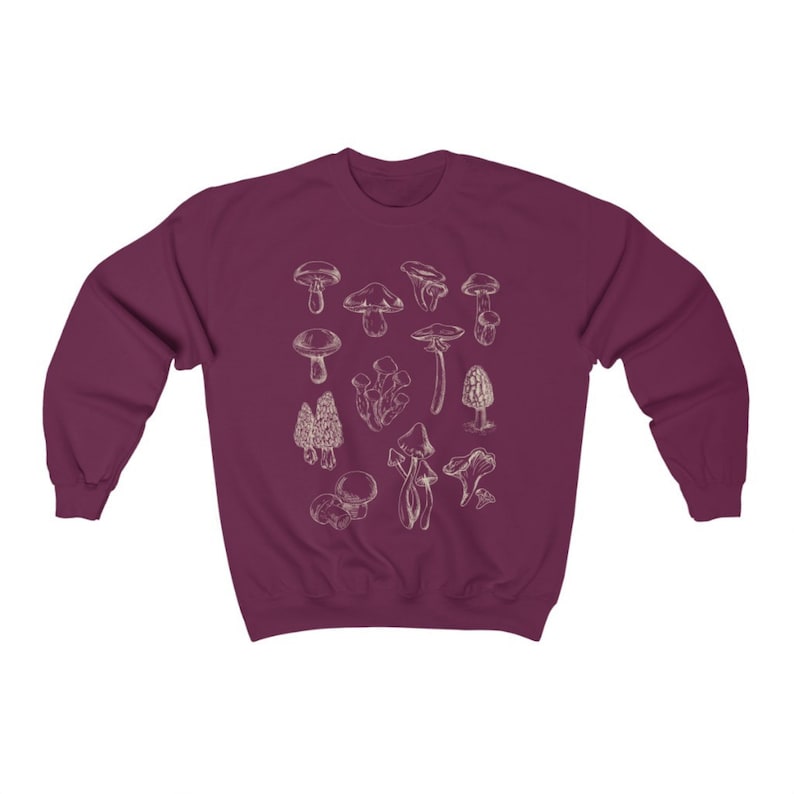 May include: A maroon sweatshirt with a white outline of various types of mushrooms printed on the front.