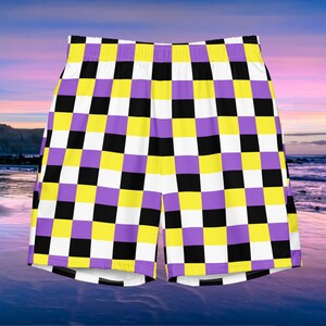 May include: Checkered shorts with a purple, yellow, black, and white pattern.