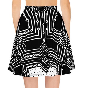 May include: A black and white skater skirt with a circuit board pattern. The skirt has a white polka dot trim at the bottom.