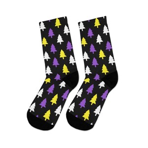 May include: A pair of black socks with a pattern of purple, yellow, and white Christmas trees.
