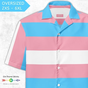 May include: A short-sleeved button-down shirt with horizontal stripes in light blue, pink, and white. The shirt has a classic collar and a button-up front. The text "OVERSIZED 2XS - 6XL" is in the upper left corner. The text "On Trend Shirts" and "Make a Statement" are in the lower left corner.