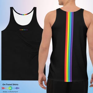 May include: Black tank top with a rainbow stripe down the back and a small rainbow design on the front. The tank top is sleeveless and made of a soft material. The text "On Trend Shirts" and "Make a Statement" are at the bottom.