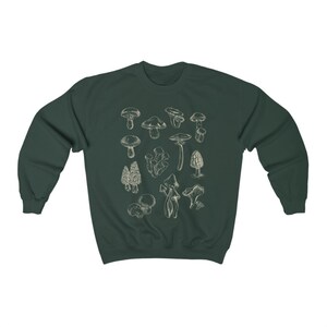 May include: A dark green sweatshirt with a white outline of various types of mushrooms printed on the front.