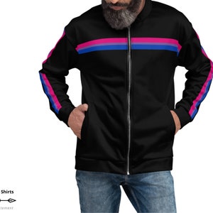 May include: Black zip-up jacket with pink, blue, and purple stripes on the sleeves and across the chest. The jacket has a front zipper and pockets. The text "On Trend Shirts" and "Make a Statement" are in the bottom left corner.