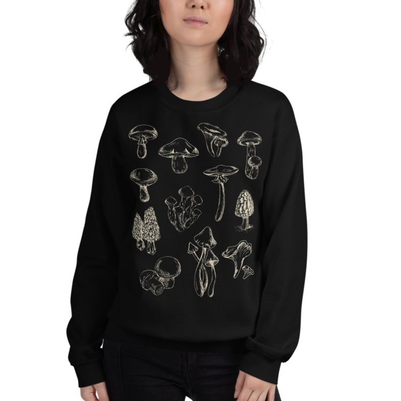 May include: Black sweatshirt with a white print of various types of mushrooms.
