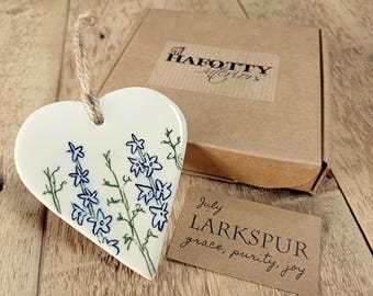 Birth flower hand-crafted ceramic hanging heart keepsake - with symbolism slip. Letterbox gift.