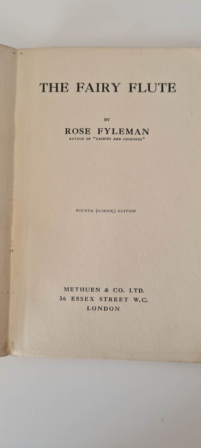 May include: The Fairy Flute book cover, by Rose Fyleman, author of "Fairies and Chimneys". The book is a fourth (school) edition, published by Methuen & Co. Ltd., 36 Essex Street W.C., London.