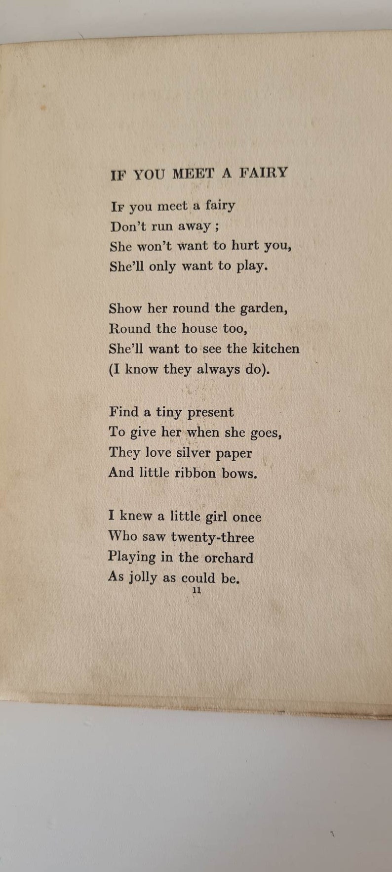 May include: A page from a children's book with the title "If You Meet A Fairy". The page features a poem about fairies and how to interact with them. The poem is written in black ink on a cream-colored page.