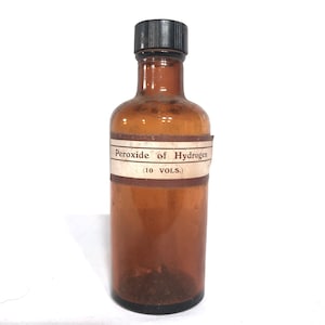 Antique bottle of Peroxide of Hydrogen. Brown glass with original label. Vintage Retro Pharmaceuticals. Medical. Antiseptic bottle.
