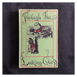 1973 vintage edition of Through the Looking Glass by Lewis Carroll, illustrated by John Tenniel.