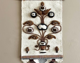 Vintage midcentury woven tapestry wall decor in brown and beige.