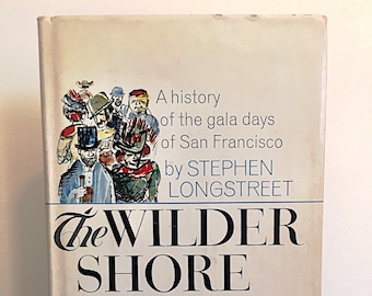 May include: A white book cover with a black and blue title "The Wilder Shore". The cover features a hand-drawn illustration of a group of people in colorful clothing and hats. The text "A history of the gala days of San Francisco by STEPHEN LONGSTREET" is printed in black.