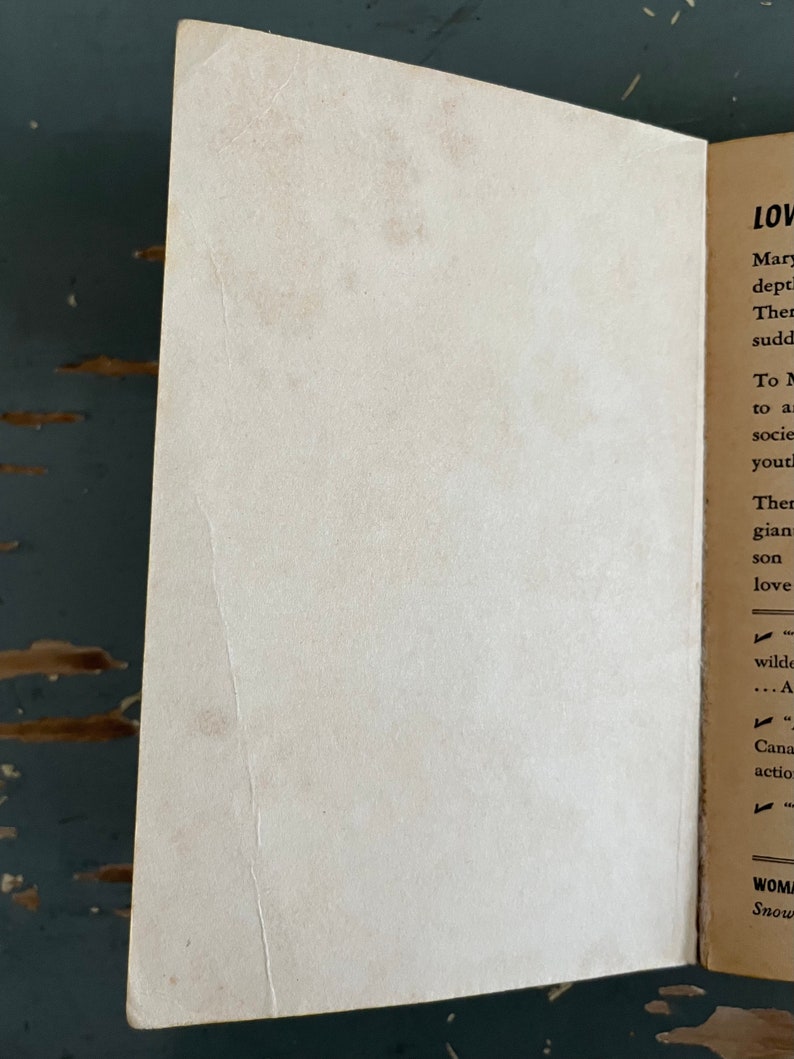 May include: A close-up of a book's inside cover with the text "LOV" and "Mary" at the top of the page. The text continues with "dept", "Ther", "sudd", "To M", "to a", "socie", "yout", "Ther", "gian", "son", "love", "wilde", "...A", "Cana", "actio", "WOM", "Snow".